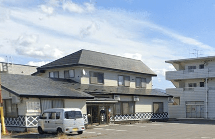 能登寿司様と隣の白いマンション